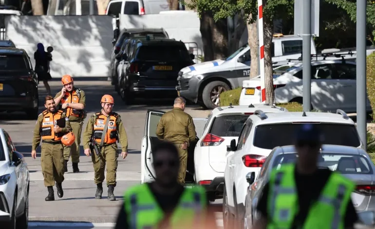 Israeli soldiers walk along a street leading to Prime Minister Benjamin Netanyahu's residence in Caesarea following reports that a drone was launched towards his residence