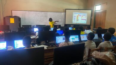 A facilitator taking the girls in an ICT session at KSTS