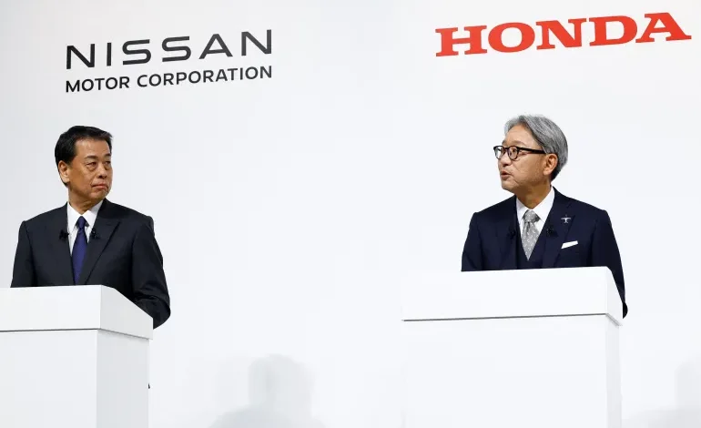 Nissan President Makoto Uchida and his counterpart at Honda, Toshihiro Mibe, hold a joint news conference on their merger plans, in Tokyo, Japan, on December 23, 2024