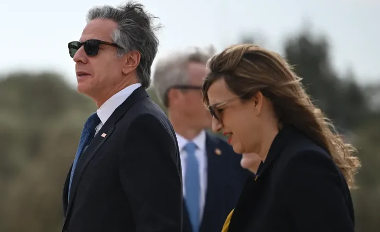 US Secretary of State Antony Blinken walks with the US ambassador to Jordan, Yael Lempert, after arriving in the Red Sea city of Aqaba on December 12, 2024