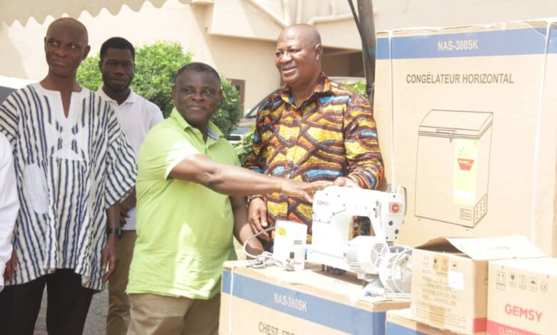 Hon Sam Pyne, Kumasi Mayor presenting some of the items to the PWDs at the ceremony