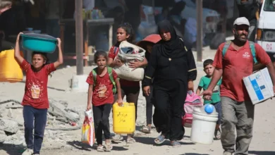 Displaced Palestinians leave an area in eastern Khan Younis