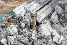 Rescuers search for missing workers after a bridge collapsed in Anseong, South Korea [Yonhap/AFP]