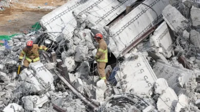 Rescuers search for missing workers after a bridge collapsed in Anseong, South Korea [Yonhap/AFP]