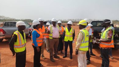 Prof Gyampo, CEO of GSA 4th left with some of the staff at Justmoh Construction during the visit to the Boankra Site