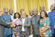 Prof. Mike Oquaye (4th from right), Chairman, NPP 2024 Election Review Committee, presenting the report to Stephen Ayesu Ntim, NPP National Chairman